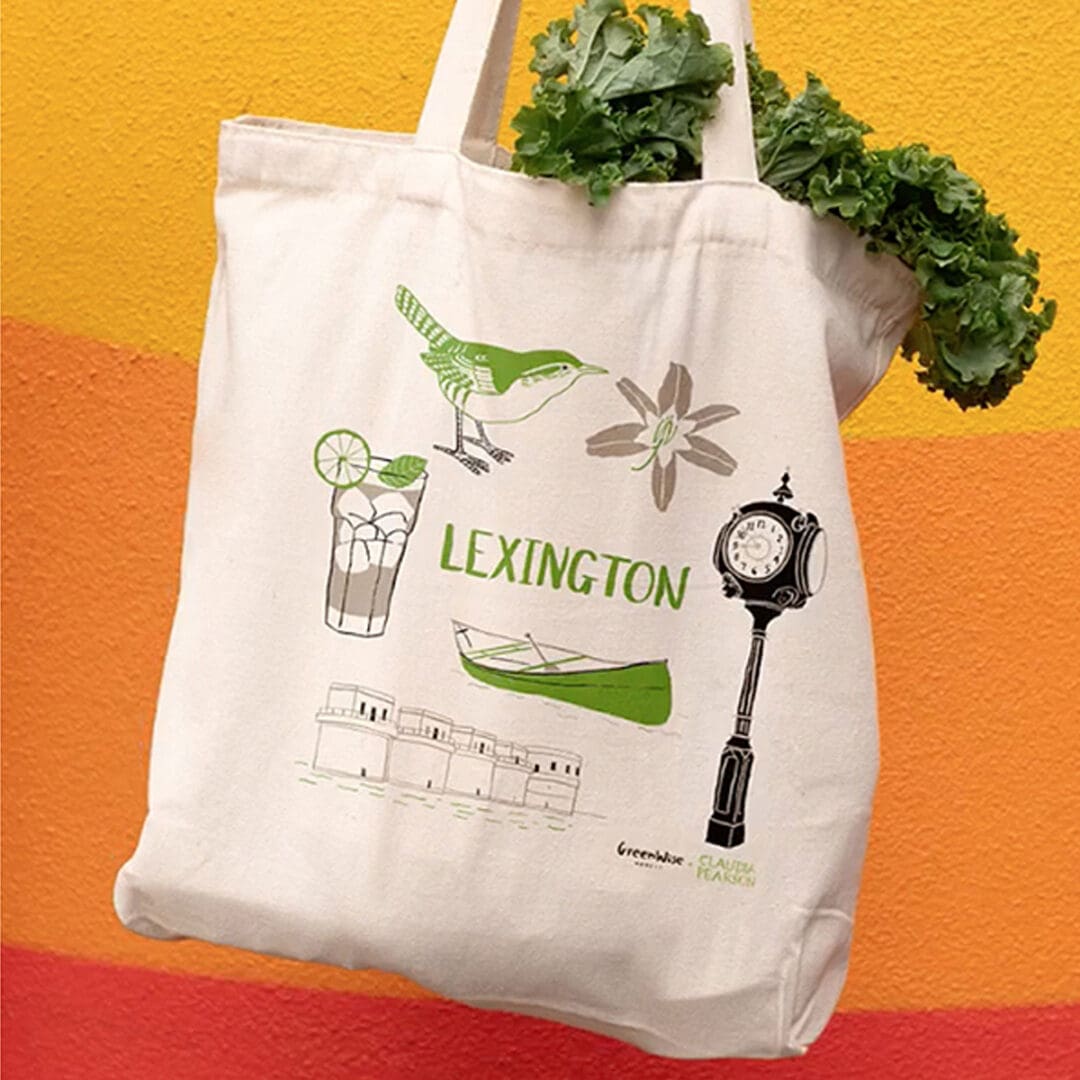 Eco-friendly tote bag with Lexington theme and fresh greens inside.