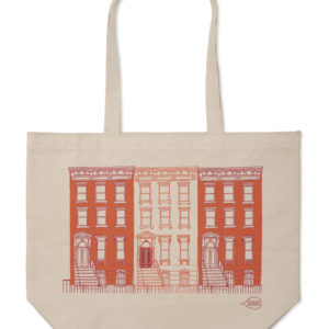 Beige tote bag with a red and white cityscape illustration.