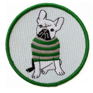 Embroidered patch of a French bulldog in a striped sweater.