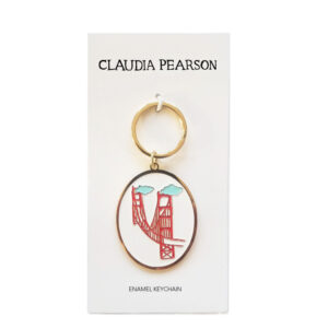 Gold keychain with red New York City design by Claudia Pearson.