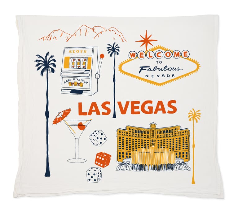 Decorative Las Vegas-themed pillow with iconic symbols and landmarks.