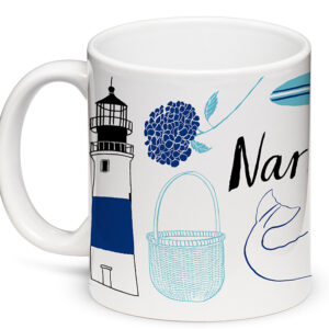 A white mug with blue nautical designs including a lighthouse and basket.