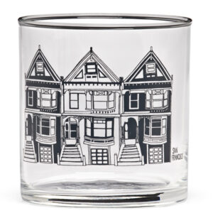 Clear glass tumbler with a black house illustration.