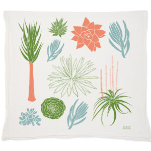 Decorative pillow with colorful, stylized plant illustrations on white fabric.