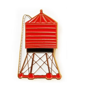 A red water tower model with a ladder on the side.