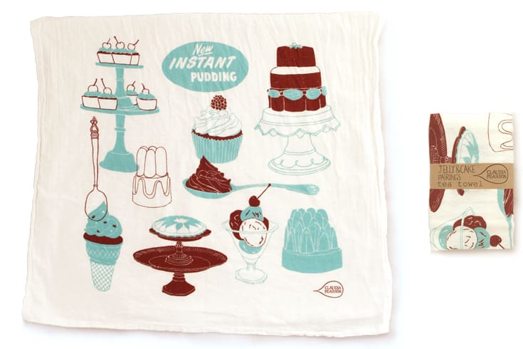 Vintage kitchen towel with dessert illustrations and recipe tips.