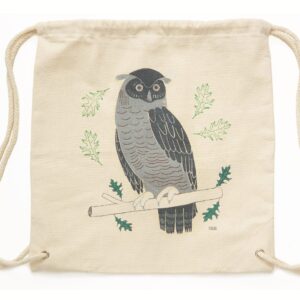 A beige drawstring bag with a printed owl design.